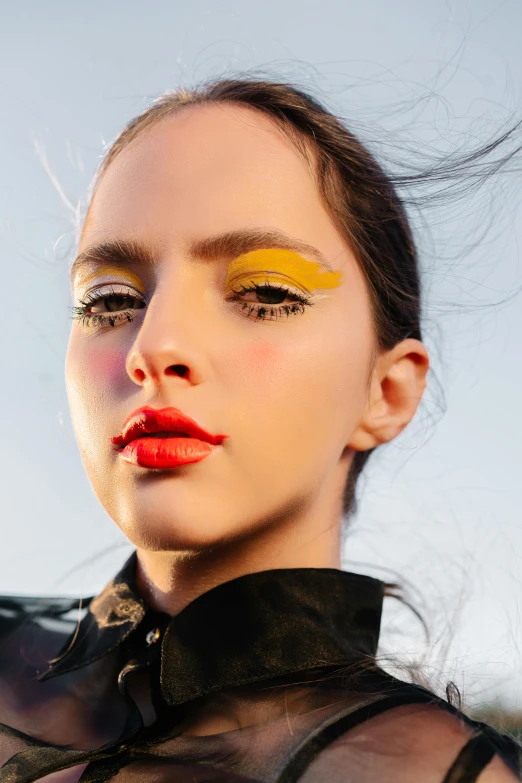 a close up of a woman with bright makeup, inspired by Bert Stern, trending on pexels, bauhaus, sunny sky, promotional image, yellow pupils, a portrait of lana del rey