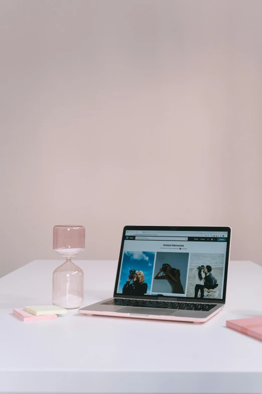 a laptop computer sitting on top of a white table, trending on pexels, light pink, avatar for website, multiple stories, pink and black