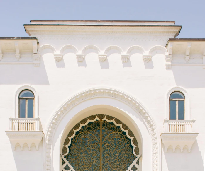 a couple of people that are standing in front of a building, an album cover, inspired by Alberto Morrocco, pexels contest winner, berlin secession, white with gold accents, islamic interior design, white sweeping arches, maxim sukharev