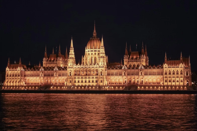 the hungarian parliament building lit up at night, pexels contest winner, 🚿🗝📝, cover shot, minimalist, haunted gothic hotel