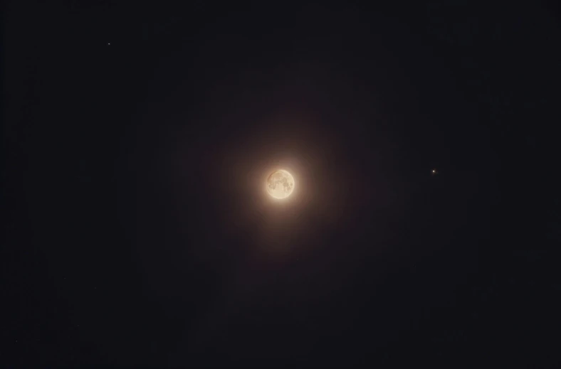 a full moon is seen in the dark sky, a picture, unsplash, space art, jupiter moon mars, three moons, star shining in space, taken on a 1990s camera