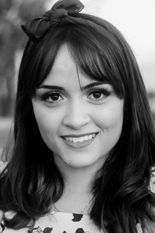 a black and white photo of a woman, inspired by Glòria Muñoz, slightly awkward smile, meredit frampton style, paul davey, professional profile picture