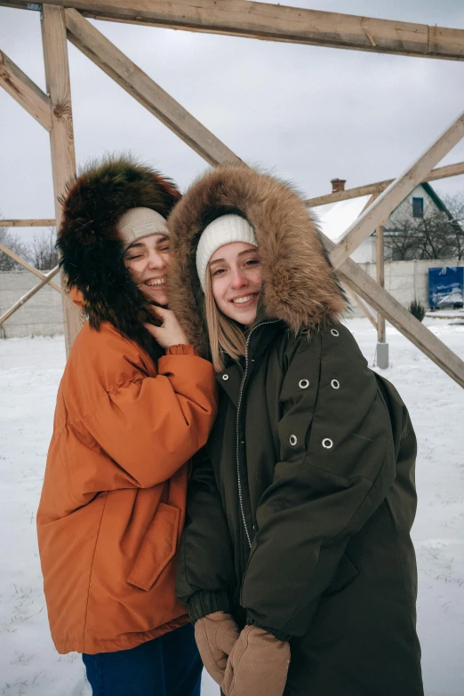 two women standing next to each other in the snow, pexels contest winner, russian girlfriend, wearing farm clothes, 🎀 🧟 🍓 🧚, wearing a hoodie