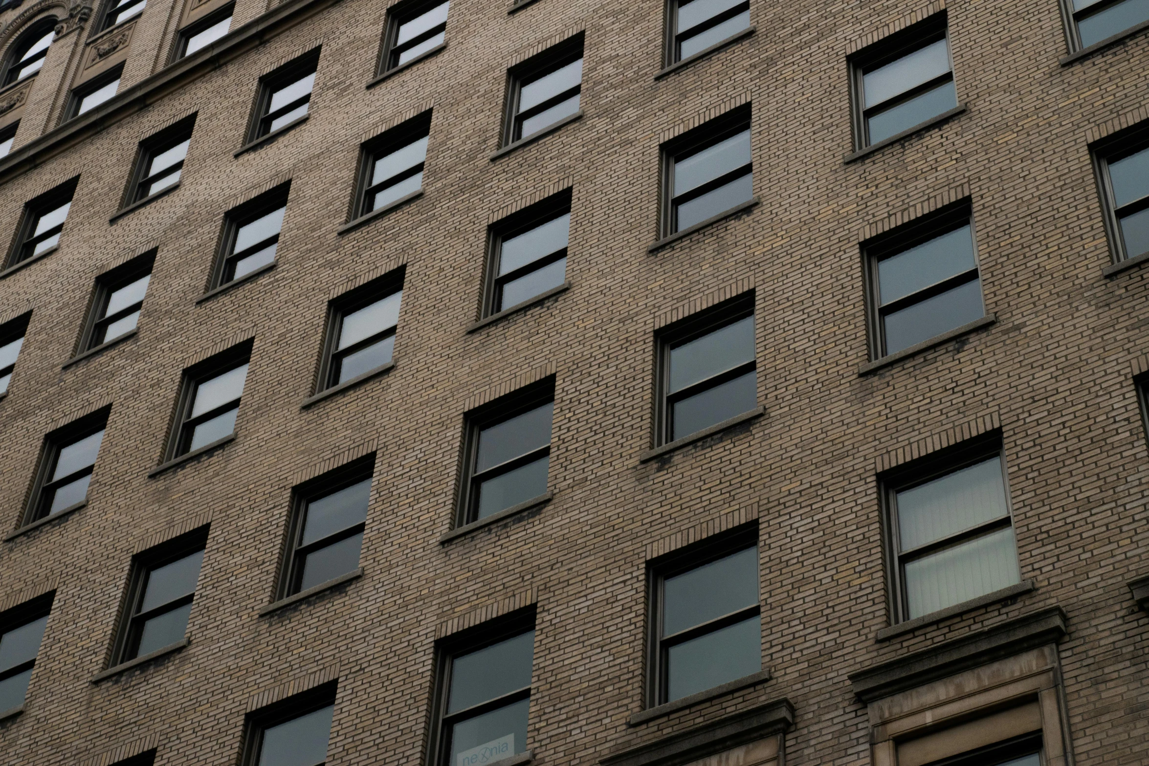 a tall brick building with lots of windows, inspired by Vivian Maier, unsplash, detail texture, ignant, buildings photorealism, 3 4 5 3 1