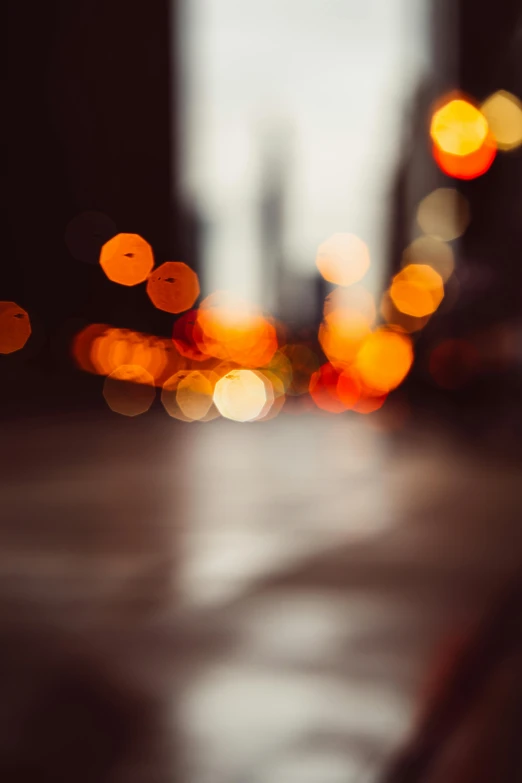 a blurry photo of a city street at night, by Niko Henrichon, unsplash, macro bokeh ”, overcast bokeh - c 5, orange lights, hazy