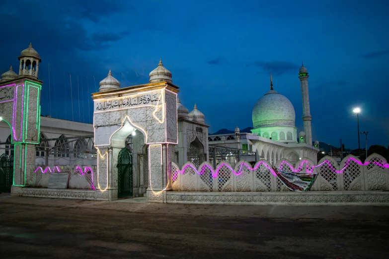 a building that has a lot of lights on it, a colorized photo, unsplash contest winner, hurufiyya, shrine, mogul khan, profile image, lpoty