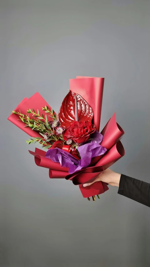 a close up of a person holding a bunch of flowers, metallic red, foil, award - winning crisp details ”, tropical flowers