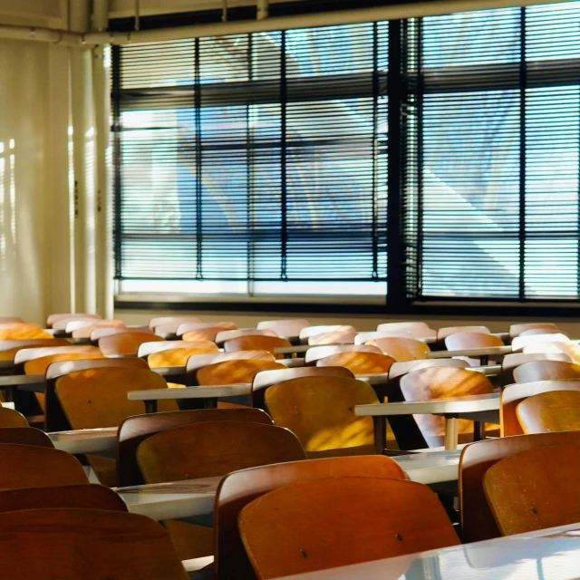 a classroom filled with lots of desks and chairs, by Carey Morris, pexels, ashcan school, late afternoon sun, kenton nelson, thumbnail, sunlit windows