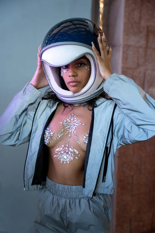 a woman in a space suit holding a helmet over her head, a hologram, inspired by hajime sorayama, afrofuturism, bralette, wearing a plug suit, portrait of vanessa morgan, jacket over bare torso