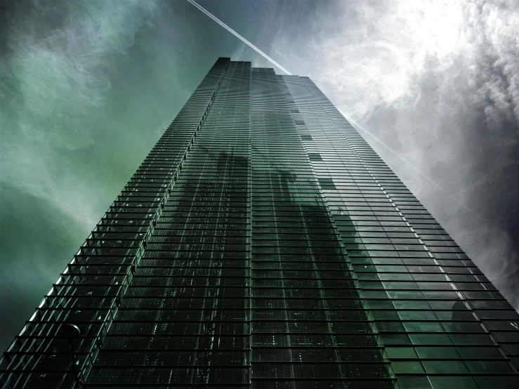 a very tall building on a cloudy day, an album cover, pexels contest winner, hypermodernism, dark green glass, hyper-realism, 4 2 0, intense atmospheric