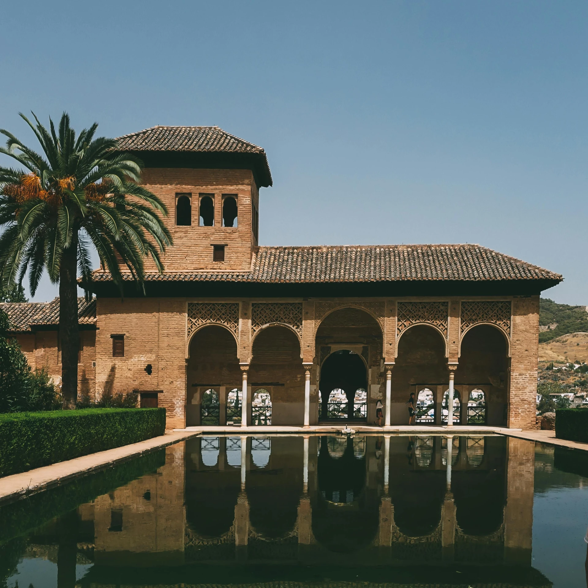 a building with a pool in front of it, inspired by Luis Paret y Alcazar, pexels contest winner, arabesque, demna gvasalia, water temple, spanish princess, unsplash 4k