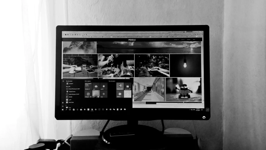 a computer monitor sitting on top of a desk, a black and white photo, pexels, linux mint, dark themes, picsart, behance lemanoosh