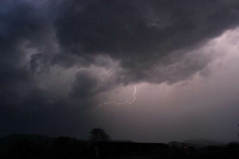 a lightning bolt hitting through a dark cloudy sky, by Dave Allsop, pexels contest winner, hurufiyya, stormy clouds outdoor, silver lining, taken in the late 2010s, ilustration