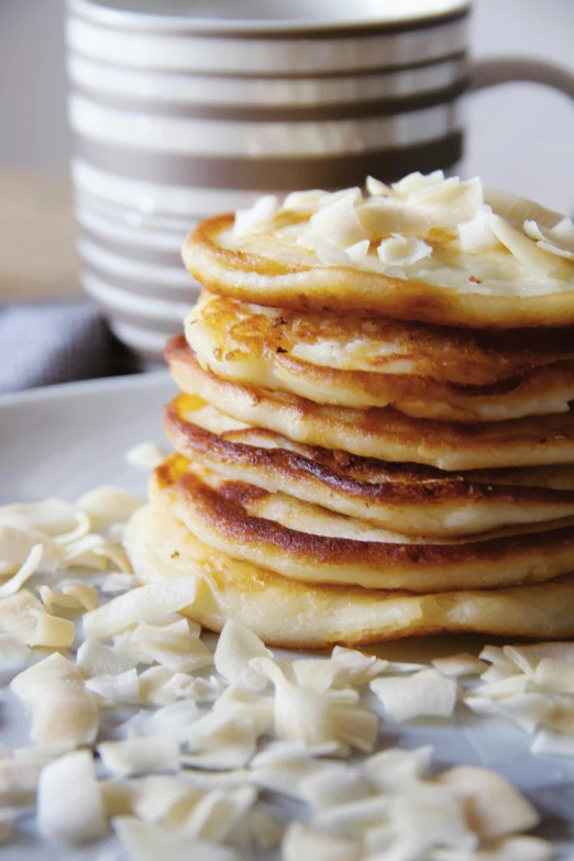 a stack of pancakes sitting on top of a white plate, by Jessie Algie, epicurious, cheese, rice, thumbnail