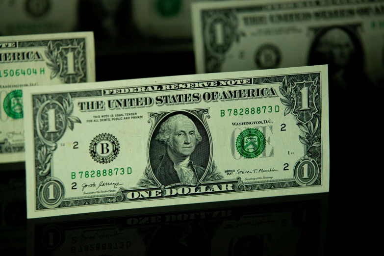 a bunch of money sitting on top of a table, a green, up close picture, thumbnail, f/1.8