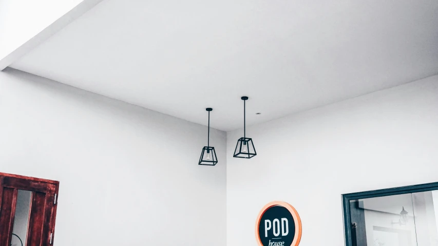 a bath room with a toilet a sink and a mirror, a minimalist painting, by Robbie Trevino, trending on unsplash, postminimalism, hanging lanterns, in a meeting room, perspective from below, two buddies sitting in a room