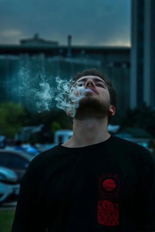 a man smoking a cigarette in a parking lot, an album cover, pexels contest winner, discord profile picture, cloudy, mac miller, photo taken at night