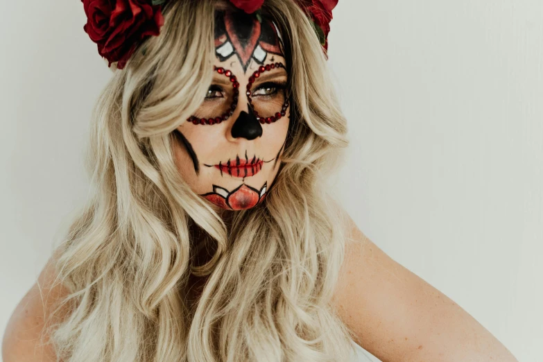 a woman with a flower crown on her head, by Sydney Carline, trending on pexels, lowbrow, skull face paint, close up of a blonde woman, wearing a fancy dress, flatlay