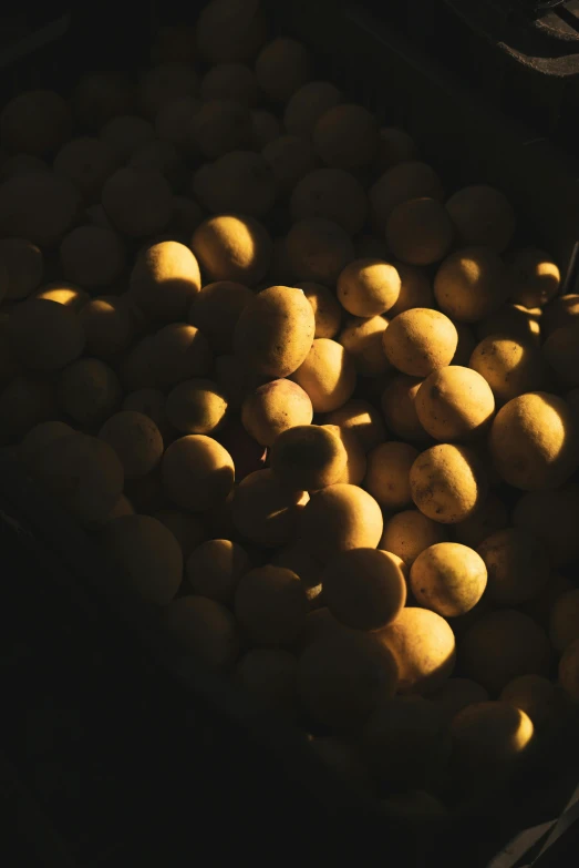 a bag full of potatoes sitting on top of a table, unsplash, tonalism, glowing orbs, backlighted, brazil, bumps