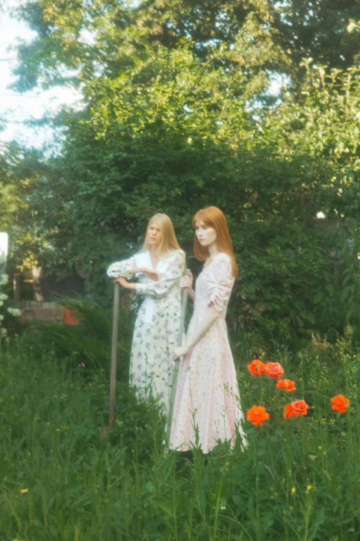 a couple of women standing next to each other in a field, an album cover, inspired by Konstantin Somov, reddit, ellie bamber, porcelain holly herndon statue, low quality photo, alternate album cover