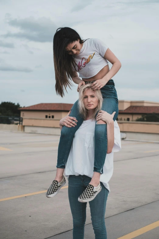 a couple of women standing on top of each other, a photo, trending on pexels, trending on r/streetwear, 15081959 21121991 01012000 4k, kailee mandel, tall girl