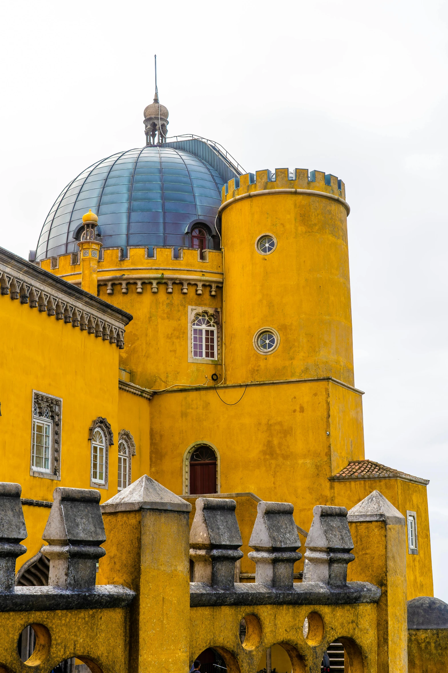 a large yellow building with a blue dome on top, inspired by Serafino De Tivoli, renaissance, nazare (portugal), fortress, red building, yellow and black