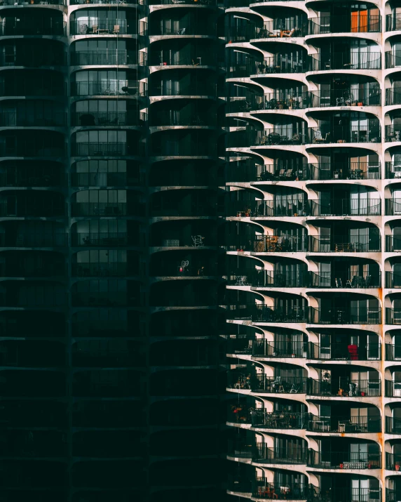 a couple of tall buildings next to each other, inspired by Ned M. Seidler, unsplash contest winner, balconies, 2000s photo, apartment complex made of tubes, chicago