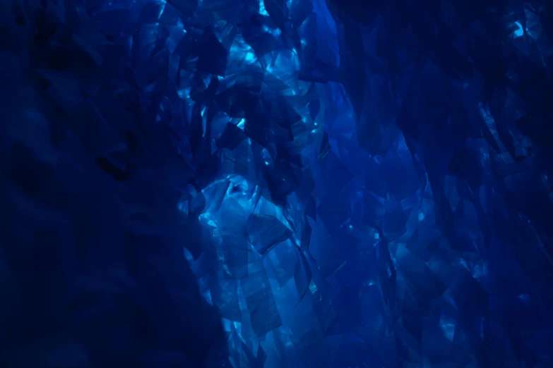 a group of people standing inside of a cave, an album cover, by David Donaldson, pexels contest winner, crystal cubism, blue translucent resin, midnight-blue, pbr materials, blue: 0.5