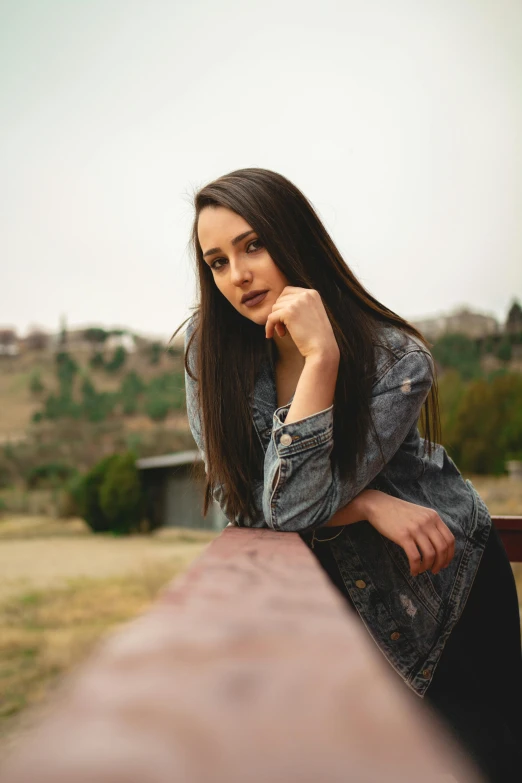 a woman sitting on top of a wooden bench, a portrait, by Winona Nelson, pexels contest winner, young woman with long dark hair, 15081959 21121991 01012000 4k, portrait rugged girl, 21 years old