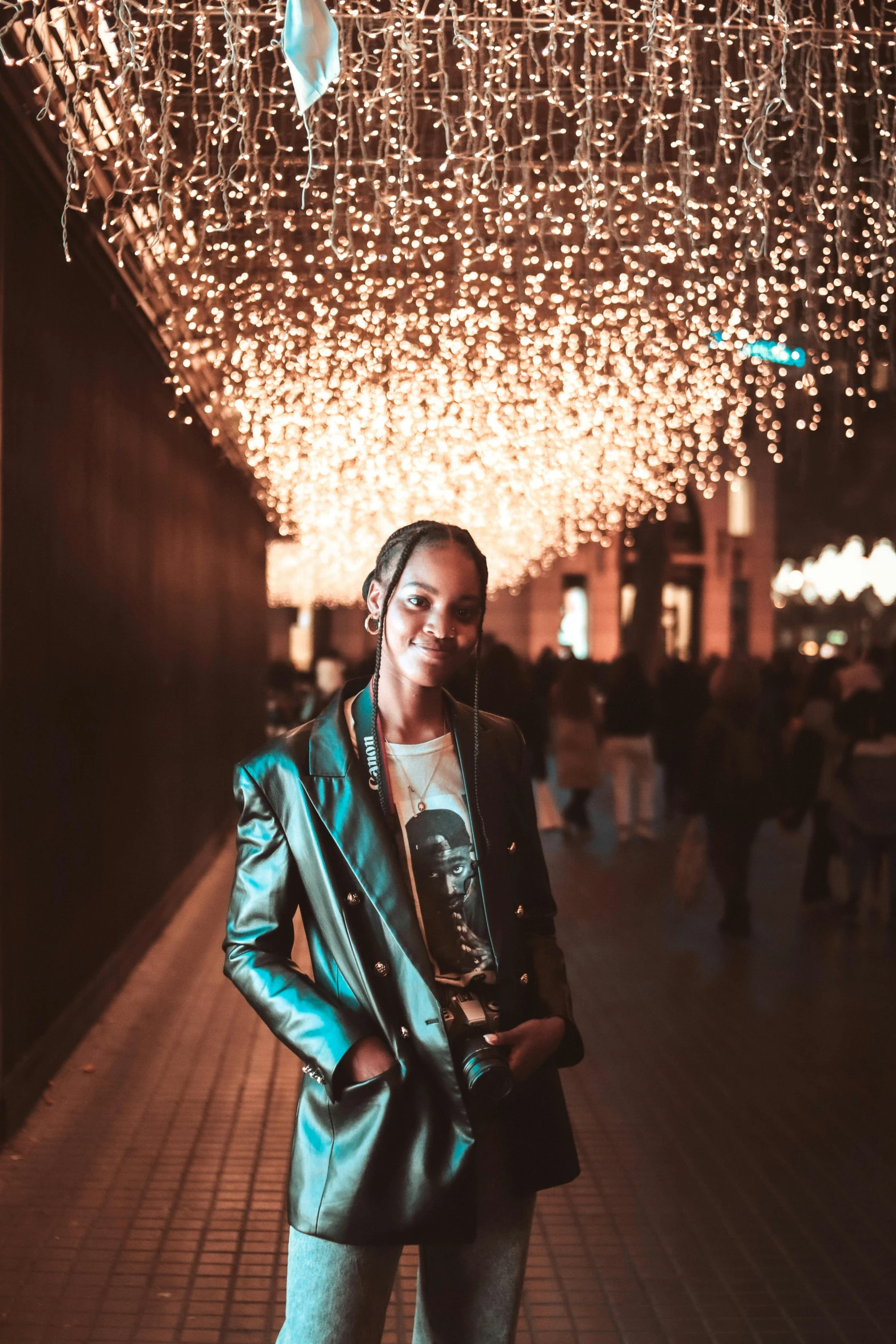 a woman standing under a canopy of lights, by Nina Hamnett, trending on unsplash, happening, wearing a fancy jacket, brown skinned, beautiful androgynous prince, instagram story