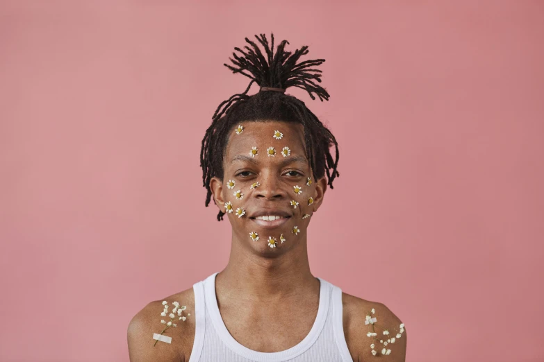 a young man with sprinkles on his face, an album cover, trending on pexels, hyperrealism, a teen black cyborg, pollen, 2022 photograph, portrait of gigachad