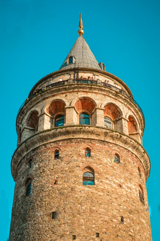 a tall tower with a clock on top of it, inspired by Altoon Sultan, trending on pexels, art nouveau, circular windows, turkey, blue sky, close-up from above