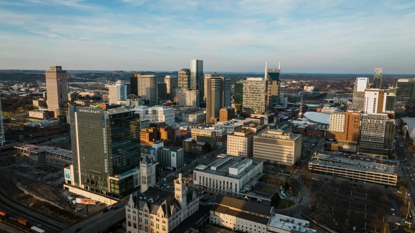 a view of a city from the top of a building, by Dan Frazier, unsplash contest winner, visual art, tn, view from helicopter, square, beautiful late afternoon