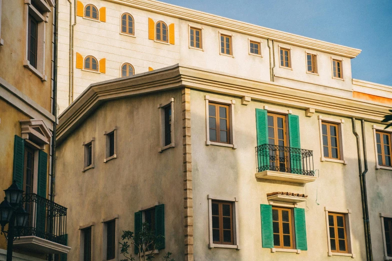 a couple of buildings that are next to each other, inspired by Wes Anderson, unsplash, art nouveau, cyprus, historical image