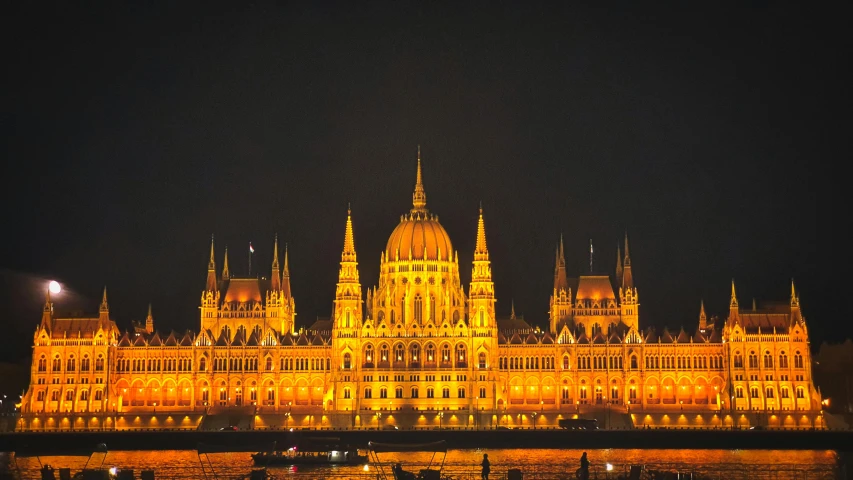 a large building that is lit up at night, by Matija Jama, pexels contest winner, hungarian, thumbnail, square, preserved historical