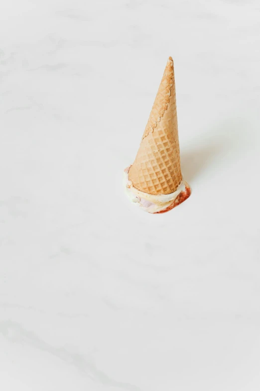 an ice cream cone sitting on top of a counter, by Andries Stock, trending on pexels, white red, flat lay, small, made of glazed