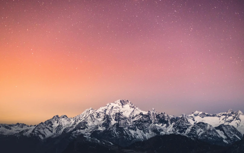 a mountain range with snow covered mountains in the background, an album cover, unsplash contest winner, colorful night sky, nepal, modern desktop wallpaper, faded glow