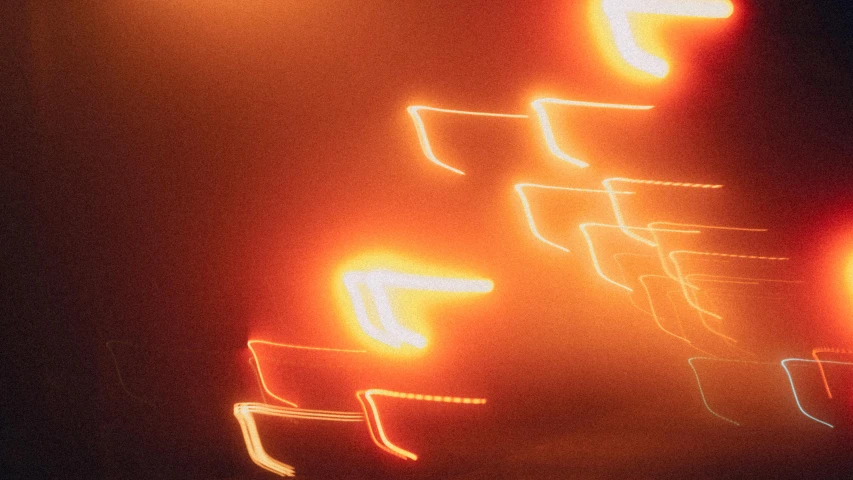 a blurry photo of a street at night, an album cover, pexels, lyrical abstraction, orange electricity, abstract neon shapes, highway, volumetric light ， surreal