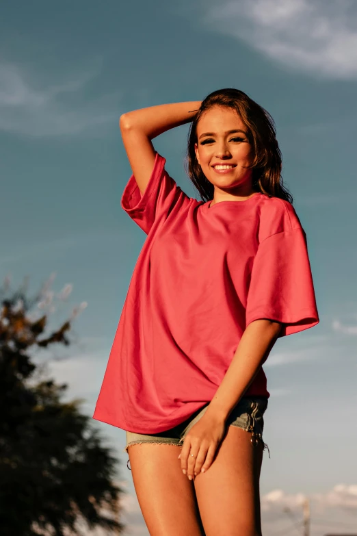 a beautiful young woman standing on top of a skateboard, by Robbie Trevino, light stubble with red shirt, thumbnail, trending on r/techwearclothing, premium