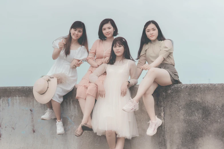 a group of women sitting on top of a cement wall, an album cover, by Tan Ting-pho, pexels contest winner, aestheticism, wearing a cute white dress, 15081959 21121991 01012000 4k, asian women, concert