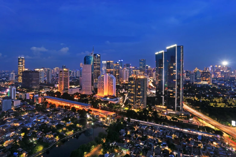 an aerial view of a city at night, by Bernardino Mei, pexels contest winner, hyperrealism, jakarta, twilight skyline, square, 8k resolution”