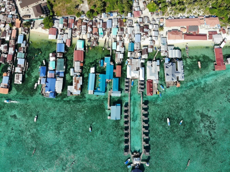 an aerial view of a small fishing village, by Daren Bader, pexels contest winner, hurufiyya, houses on stilts, coral reefs, thumbnail, overdetailed