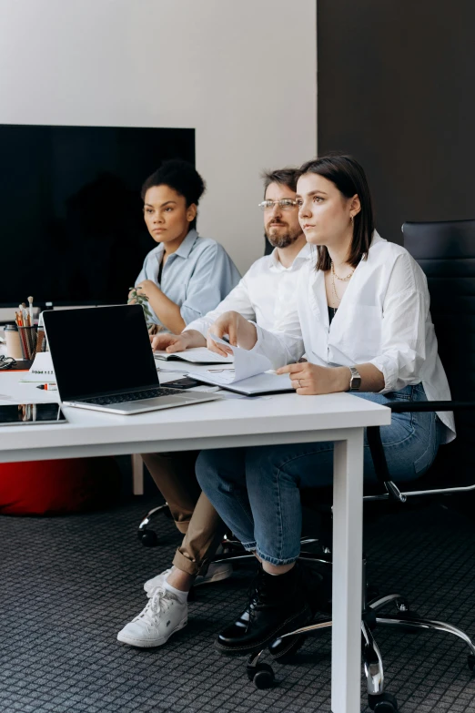 a group of people sitting around a table with laptops, pexels contest winner, arbeitsrat für kunst, wearing business casual dress, standing in class, slightly minimal, avatar image
