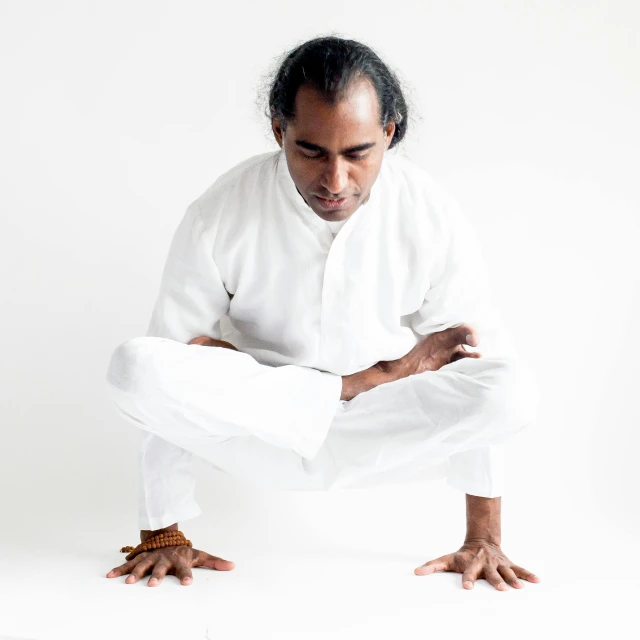 a man kneeling down with his hands on his knees, by Matija Jama, anjali mudra, wearing white cloths, portrait image, ranjit ghosh