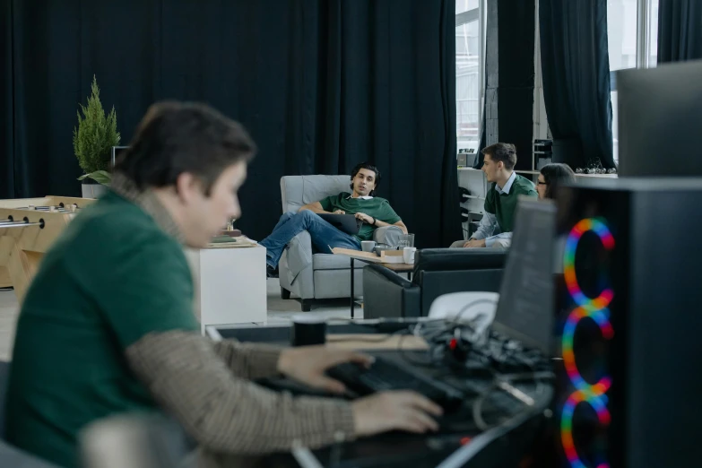 a man sitting in a chair in front of a computer, bringing people together, vfx shot, taken with sony alpha 9, nvidia promotional image