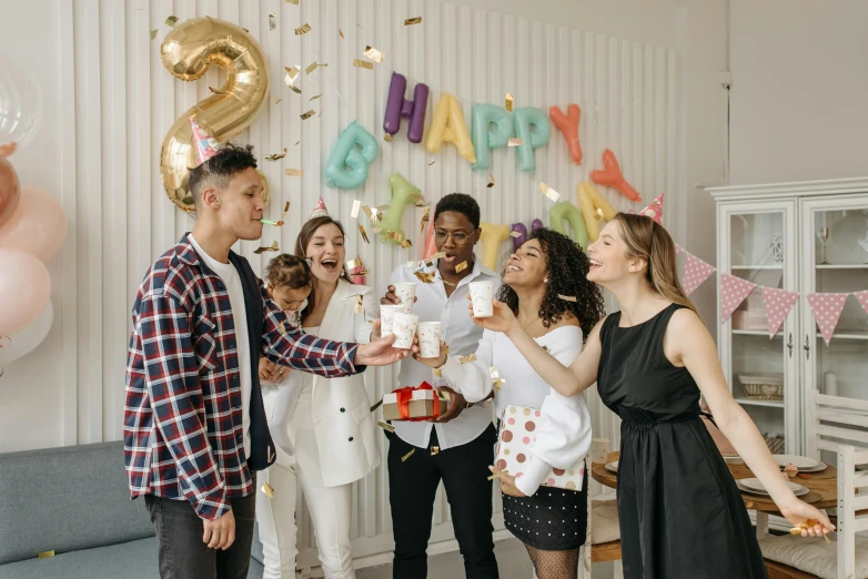 a group of people celebrating a birthday party, by Emma Andijewska, pexels contest winner, fan favorite, giving gifts to people, product introduction photo