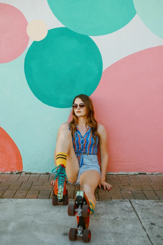 a woman sitting on a skateboard in front of a colorful wall, jenna barton, young southern woman, profile image, multiple stories