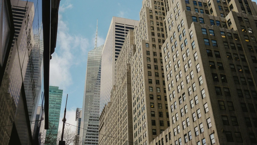 a group of tall buildings sitting next to each other, art deco buildings, 2022 photograph, new york buildings, ad image