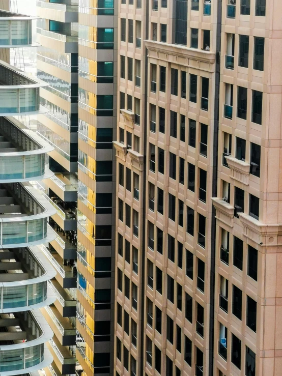 a group of tall buildings next to each other, inspired by Andreas Gursky, pexels contest winner, yellow windows and details, sydney, stalinist architecture, tall terrace