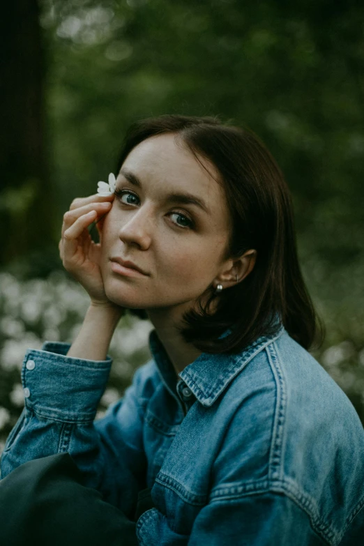 a woman holding a cell phone to her ear, a picture, pexels contest winner, antipodeans, portrait of arya stark, in the garden, slight freckles, casual pose